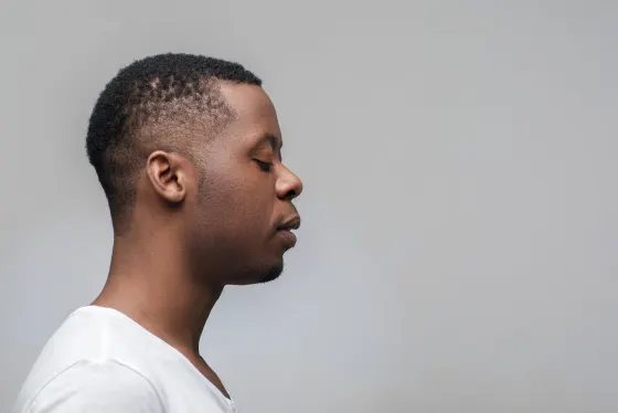 Clean short fade on a man in profile