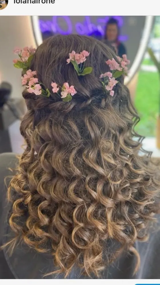 Curly half-up style with small flowers