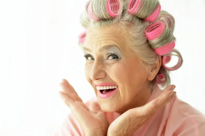 Happy client in pink rollers