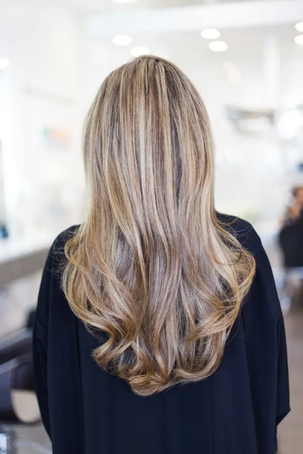 Long, glossy blonde-highlighted hair